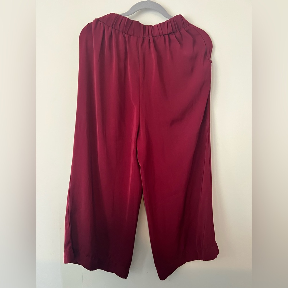 Flowy red closer to burgundy pants